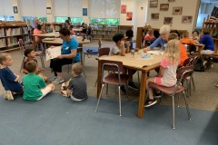 Volunteers reading to students in 21st Century Community Learning Centers summer program at Snyder Girotti in Bristol Borough