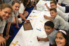Children at St. Mark Bristol Borough drawing their responses to The Widow’s Broom